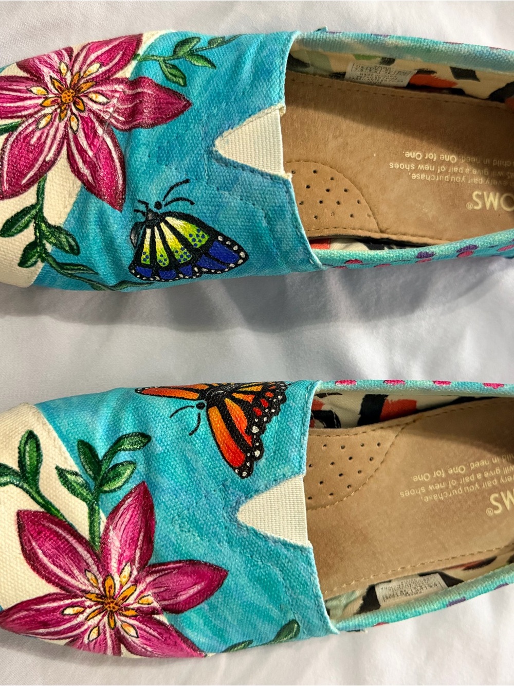 Toms Turquoise Canvas Slip-Ons with Pink Floral & Orange Butterfly & Hibiscus
